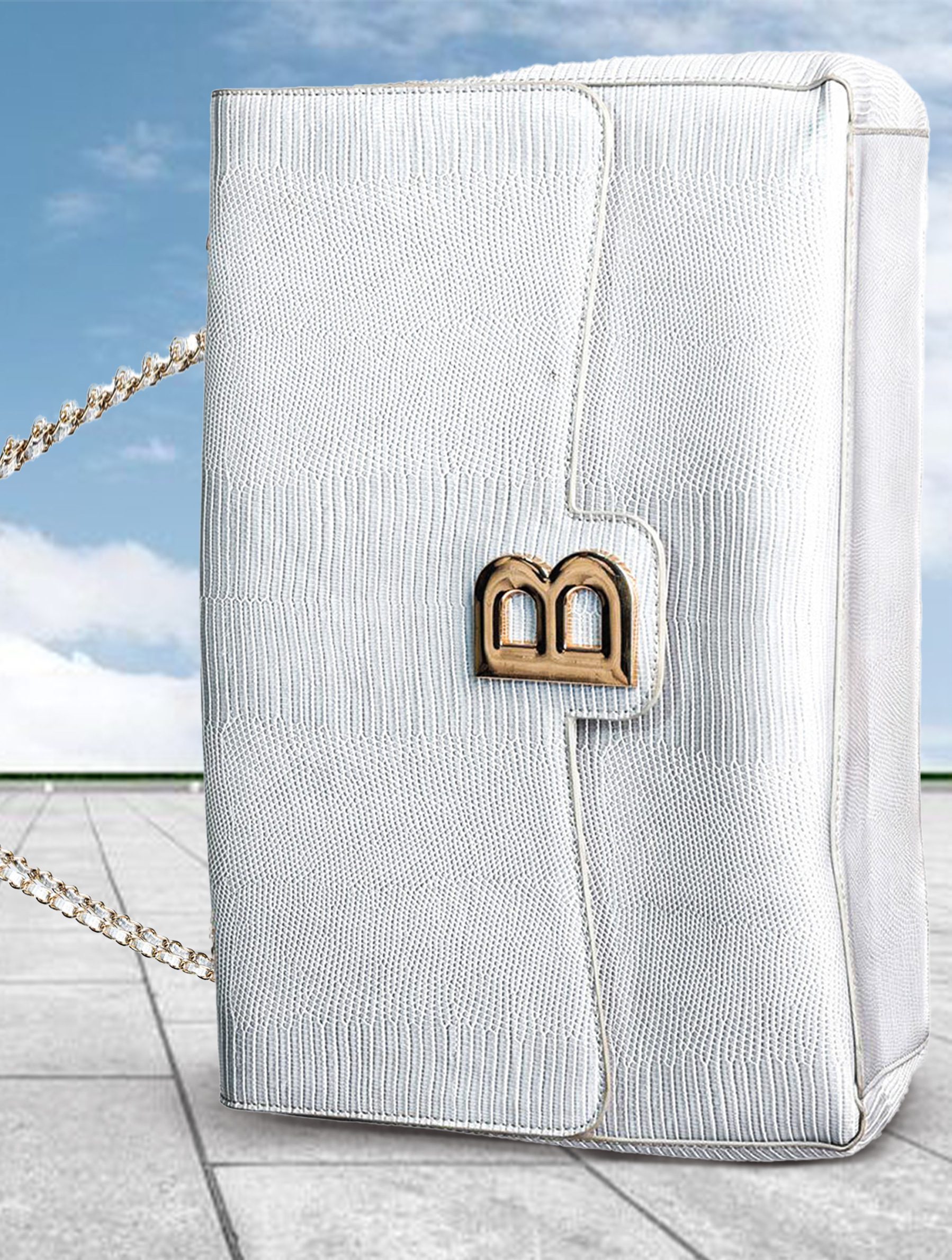 Oversized luxury white chain handbag styled in a surreal high-fashion editorial composition featuring exaggerated scale and modern minimalism.